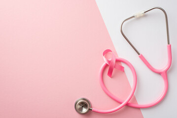 Breast cancer awareness concept. Top view photo of pink satin ribbon and stethoscope on bicolor...