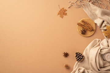 Autumn mood concept. Top view photo of cinnamon sticks anise on rattan serving mat yellow maple...