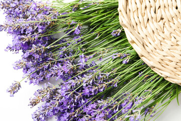 Lavender in wicker bag on white background