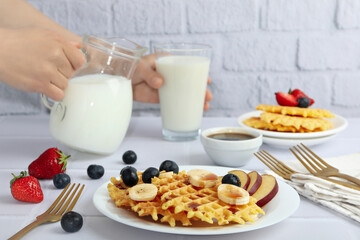 Concept of tasty food with wafers with fruits, berries and caramel
