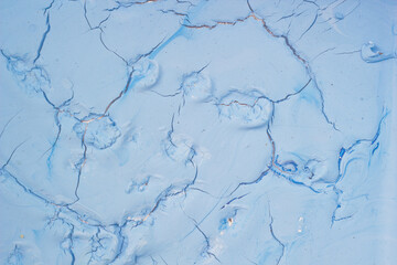 Dry blue oil paint cracks and crevices texture for background