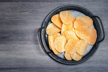Potato chips in a vintage black tray