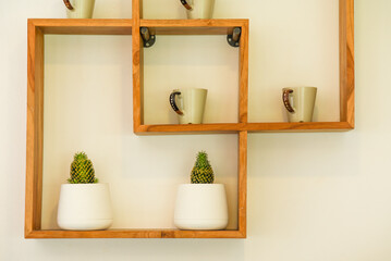 wall mounted coffee cup shelf.
cactus shelf.
