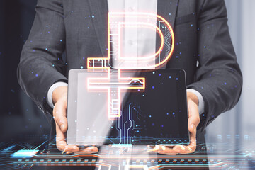 Businessman hands holding pad with creative glowing Russian ruble hologram on blurry office interior background. Digital money and online banking concept. Double exposure.