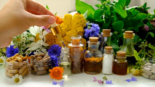 Herbal tinctures homeopathy with medicinal herbs. Selective focus.