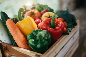 wooden box full of fresh vegetables.