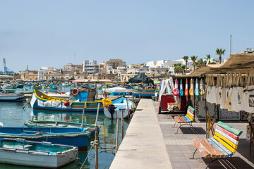 Fototapeta na wymiar Luzzus, las barcas de Marsaxlokk en Malta, coloridas embarcaciones