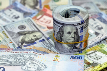 Saudi Arabia riyals money banknotes of 500 riyals, 100 and 50 riyal with USA American cash money...