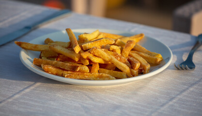 French fries in a plate on a table