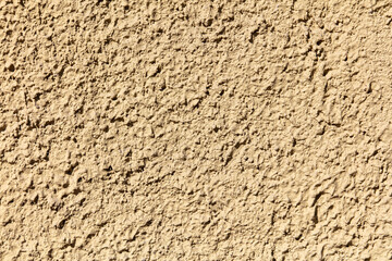 Decorative plaster on the wall of the house as an abstract background.