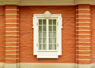 Window in the wall of a brick house.