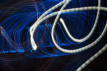 Beautiful Abstract futuristic painting color texture with lighting effect. Modern dynamic shiny pattern. Fractal graphic artwork design. Creative long exposure photography. Abstract lights at night.