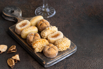Panelles assortment on wooden cut board, typical sweets in Catalonia ,Spain for All Saints Day.