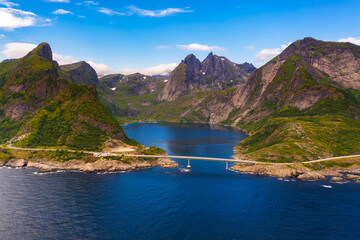Naklejka premium Aerial view of Djupfjorden fjord surrounded by high mountains in Lofoten, Norway