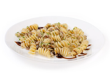 Prepared spiral pasta with chopped meat and dill on dish