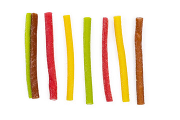 Multicolored jelly stick candies on a white background