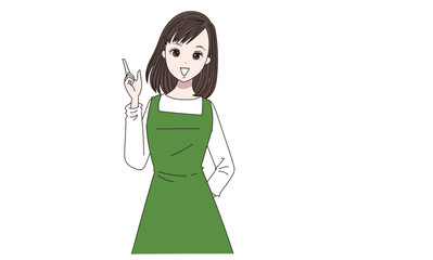 指差しをするエプロン女性