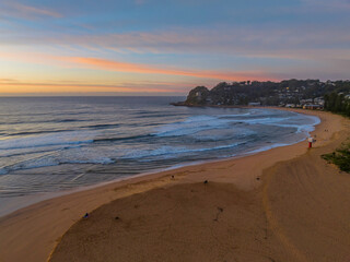 Sunrise and high cloud cover over the sea