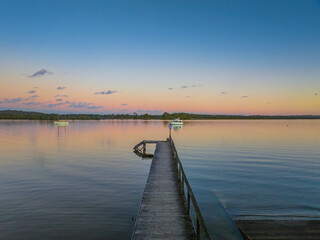 Fototapeta premium Sunset over the river with boats