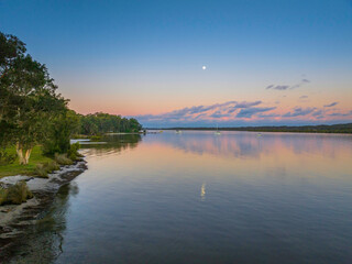 Sunset over the river with boats