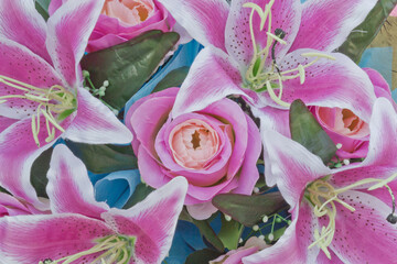 Obraz premium Close up view of a beautiful bouquet of mixed coloful flowers . The concept of a flower shop and flower delivery as a family business, florist work.