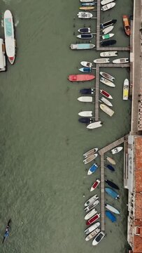 Top view of the Grand Canal with empty gondolas tied to the pier