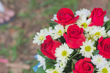 close up of red roses on a bouquet