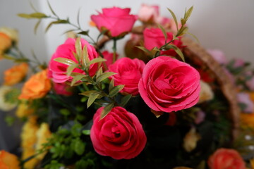 bouquet of red roses fake flowers composition macro, flowers decoration ornamental background, made from fabric and plastic