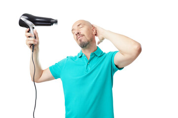 Bald man using hair dryer like a gun isolated on white background. Humor concept.
