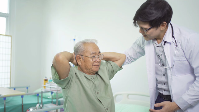 Happy Old Elderly Asian Patient Or Pensioner And A Doctor Smiling, Doing Exercise, Working Out  In Nursing Home In Hospital. Senior People Lifestyle Activity Recreation. Health Care Physical Therapy.