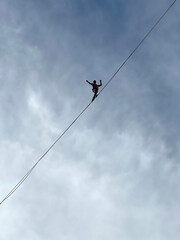 French tightrope walker Nathan Paulin walks on a 950 meters long slackline, 50 meters over Geneva...