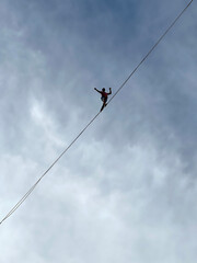 French tightrope walker Nathan Paulin walks on a 950 meters long slackline, 50 meters over Geneva Lake between the right and left banks of the city during an event part of the Swiss National Day. © marcio
