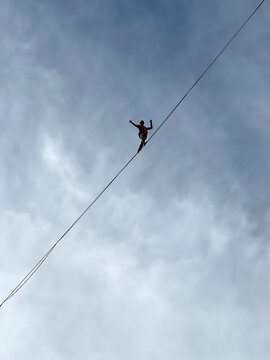 French tightrope walker Nathan Paulin walks on a 950 meters long slackline, 50 meters over Geneva Lake between the right and left banks of the city during an event part of the Swiss National Day.