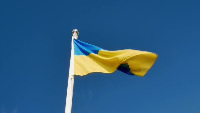 flag of Ukraine against blue sky