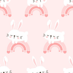 Fototapeta premium Seamless pattern with bunny rabbit cartoons and rainbows on pink background vector.