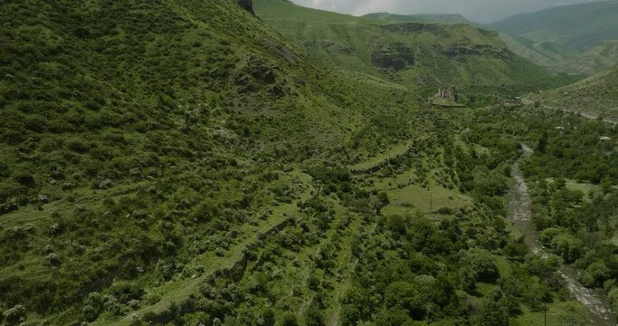 Farming Terraces On Mountain Slopes Along The Paravani River With Khertvisi Fortress In The Distance. - aerial