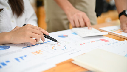 A team of financial analysts having a meeting together. cropped image