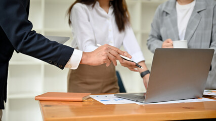A group of business people working together, discussing and planning their business strategy