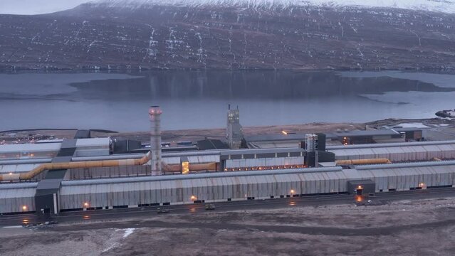 Industrial aluminium factory on fjord shore in Iceland, aerial