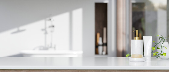 Bathroom tabletop with shampoo bottle, soap, and copy space over blurred elegance bathroom