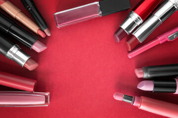 Lipsticks on red background