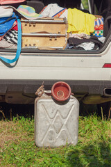 car and empty jerrycan