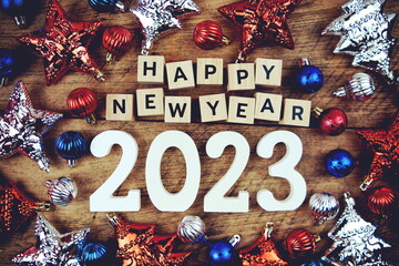 Happy New Year 2023 alphabet letters with Christmasl Decoration on wooden background