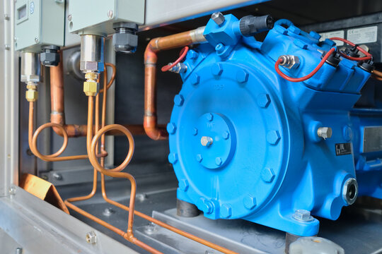 Semi hermitic compressor motor assembly of an explosion proof air-conditioning unit for offshore application.