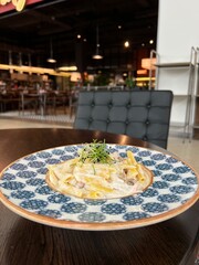 pasta with cheese in a cafe