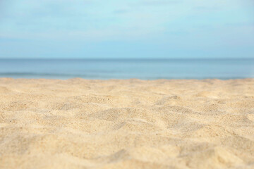 Fototapeta na wymiar Closeup view of sandy beach near sea
