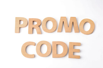 Words Promo Code made of wooden letters on white background, top view