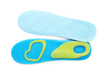 Light blue orthopedic insoles isolated on white, top view