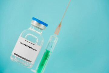 Thyroid hormone. Test tube with artificial hormone on pink background Thyroid hormone