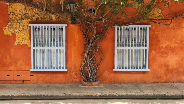 Cartagena - Colombia - View of orange wall with white windows